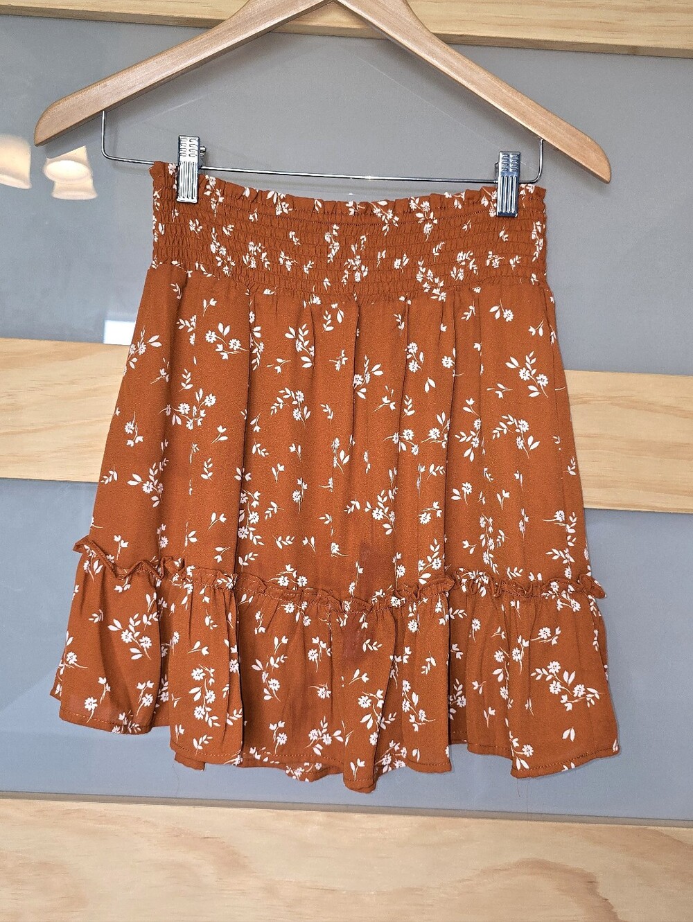 Lola Grace Smocked Mini Skirt. Rust With Cutesy White Floral Pattern